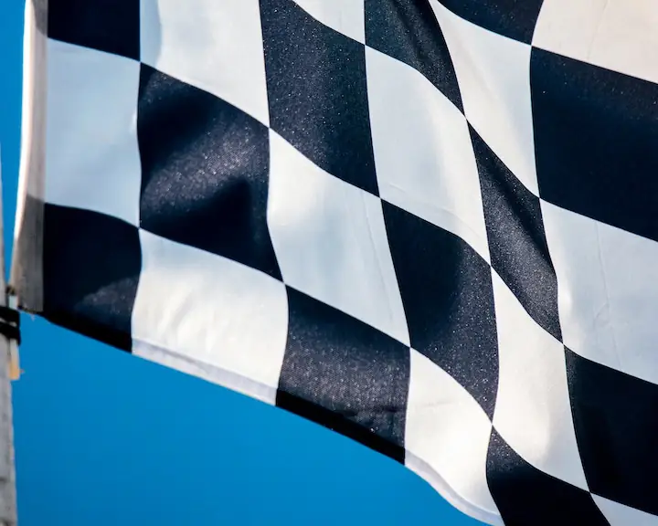 race flag waving in blue sky