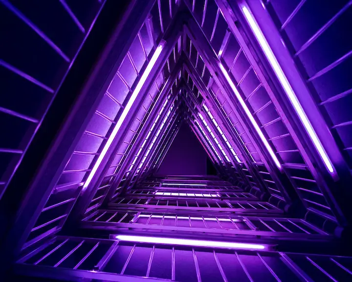 neon purple lights in a triangular spiral format