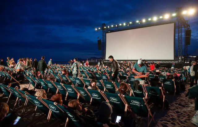 Outdoor movies with beach chairs lined up in front